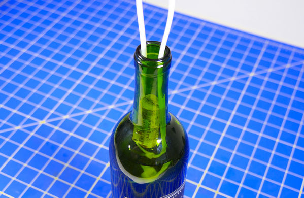 open bottle with straw