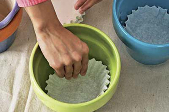 Coffee Filter Helps Soil from Sipping From the holes