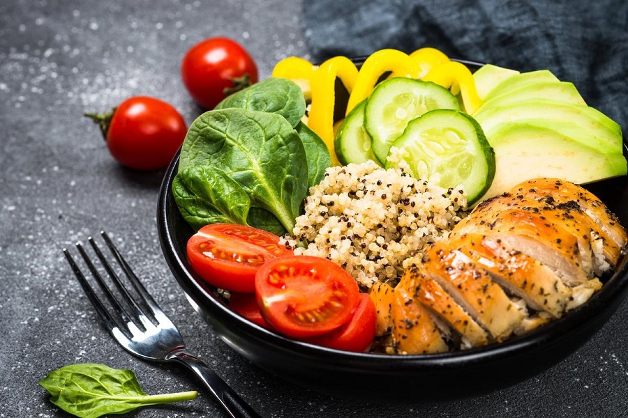 LI-SISMONDO-CARBS Plate of food with  a low net carb count. Buddha bowl on black. Healthy salad from quinoa, chicken, spinach, avocado and tomatoes. Top view. Uploaded by: Robertson