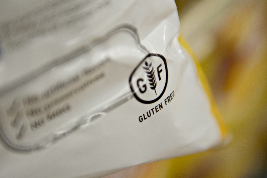 "Gluten Free" appears on the packaging for a bag of Frito-Lay Inc. Lays brand potato chips displayed for sale at a supermarket in Princeton, Illinois, U.S., on Wednesday, Aug. 7, 2013. The Food and Drug Administration (FDA) is issuing a final rule to define the term "gluten-free" when voluntarily used in food labeling, according to a notice published in the Aug. 5 Federal Register. Photographer: Daniel Acker/Bloomberg via Getty Images
