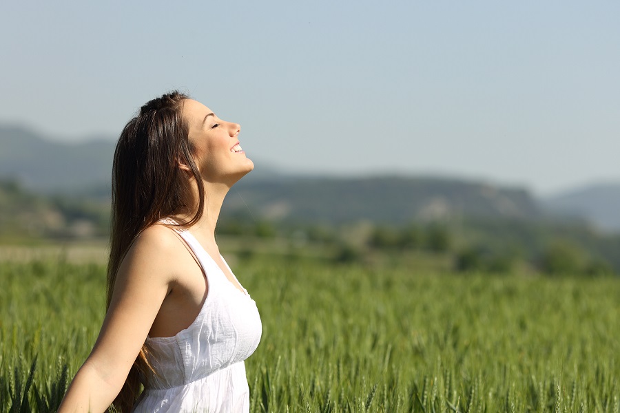 Girl Breathing Fresh Air With White Dress